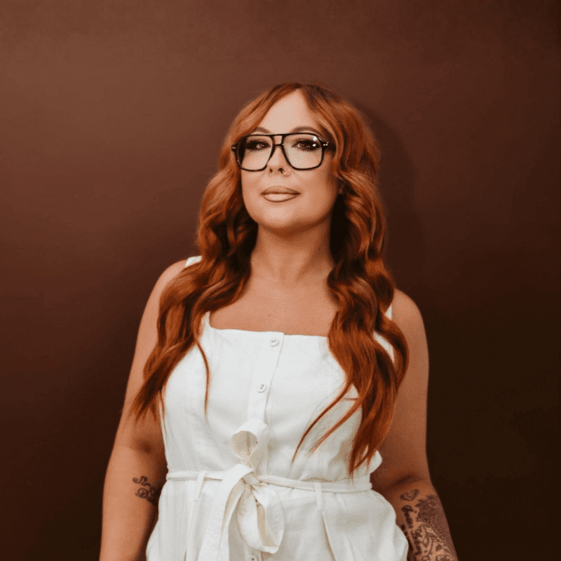 Portrait of Kay, a professional stylist at House of Rose Styling Co., showcasing their expertise and style.