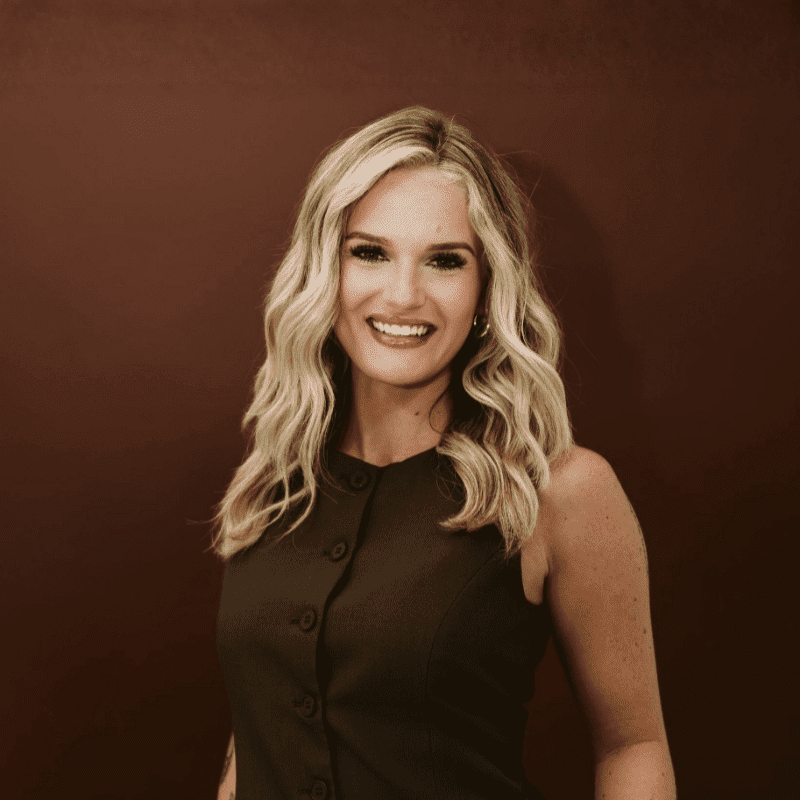 Portrait of Caleigh, a professional stylist at House of Rose Styling Co., showcasing their expertise and style.