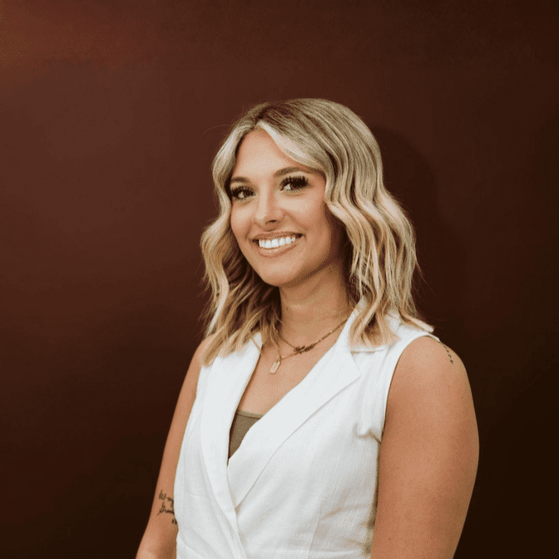 Portrait of Macie, a professional stylist at House of Rose Styling Co., showcasing their expertise and style.